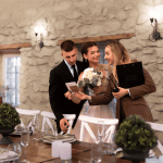 Event coordinator with a nuptial couple